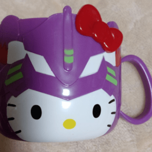 Hello Kitty mug featuring a purple EVA-01 helmet design and red bow on top, set against a light background