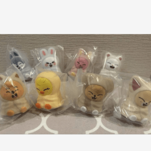 Set of cute, animal-shaped marshmallow figures in clear packaging, including a cat, chick, dog, and bunnies on a surface.