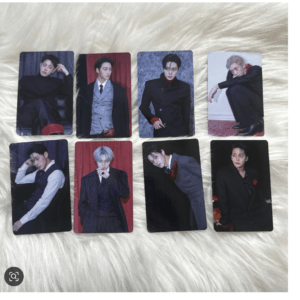 Eight portrait cards showing men in stylish suits, arranged in two rows on a soft white fur surface.