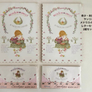 Two decorative note cards with pink floral borders reading 'Meadow Sweet In the Rose Garden' and two matching envelope packs (pink).