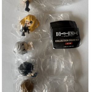 Five chibi anime figures in clear plastic packaging, with a Death Note: Collection Figure Rich label card nearby.