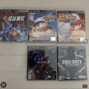 Six PlayStation 3 game cases laid out on a light tiled floor, arranged in two rows of three (three on top, three on bottom).