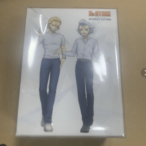 Packaging box featuring Dr. Stone: Science Future logo with two anime-style men standing side by side against a light geometric background.