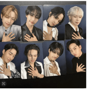 Collage of eight portrait cards featuring K-pop group members with hands on their chests, posing in stylish outfits against blue backgrounds