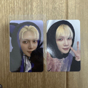 Two glossy photo cards featuring a person with blonde hair in a black hoodie; left card is a close-up, right card shows peace sign.