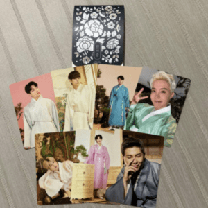 Set of glossy photocard photos showing a man in hanbok in various colors, arranged around a floral decorative card.