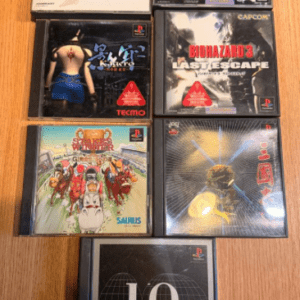 Six PlayStation game cases laid on a wooden table; titles visible include Final Fantasy VII, Biohazard 2, Biohazard 3: Last Escape, IQ (Intelligent Qube), and two other colorful covers whose exact names are unclear for quick identification.