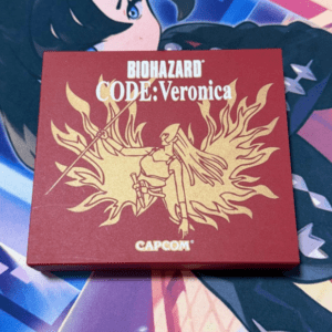 Red box for Biohazard Code: Veronica by Capcom, featuring a gold winged figure emblem and the Capcom logo.