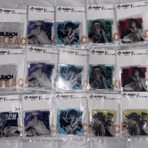 Fifteen Bleach character cards in plastic sleeves laid out on a table, each with colorful backgrounds and a bold BLEACH logo edge to edge.",
