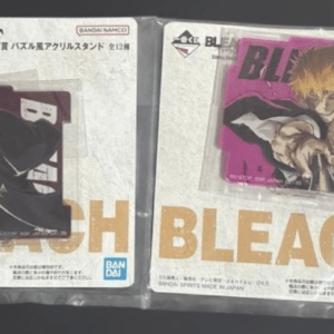 Two Bleach acrylic standee figures in original packaging, each with character art and Bandai logos.