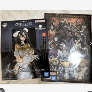 Two boxed anime figures from Overlord viewed side by side: a white-armored female figure on the left and a detailed illustrated box on the right.