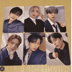 Six portrait photo cards of young men posing for selfies on a yellow table surface.